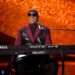 Stevie Wonder performing at keyboard with synthesizer, demonstrating his innovative approach to melodic composition and arrangement